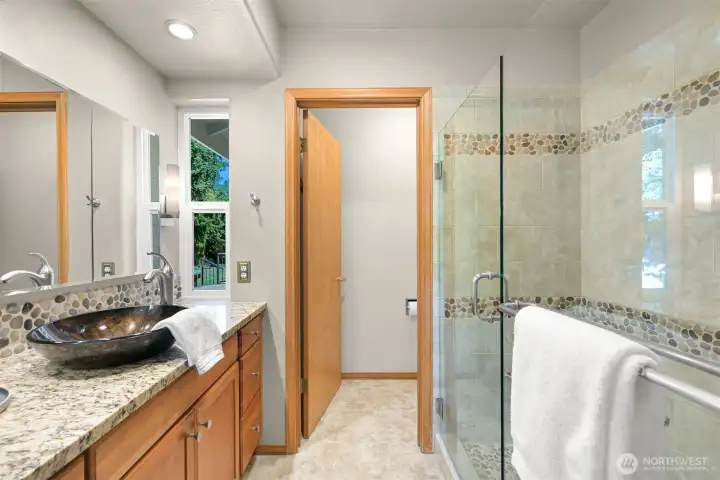 Primary bathroom was tastefully remodeled in 2008 with radiant heated flooring, PNW spa-inspired theme. Primary bathroom was tastefully remodeled in 2008 with radiant heated flooring, PNW spa-inspired theme.