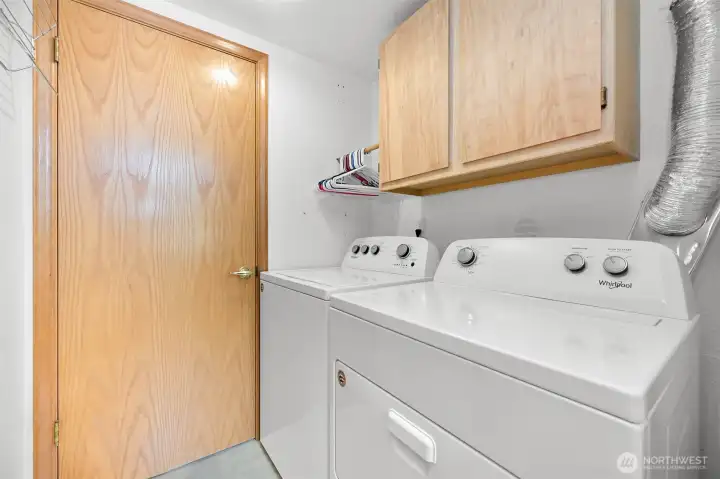 Laundry room downstairs, with an additional access door to the bathroom. Laundry room downstairs, with an additional access door to the bathroom.