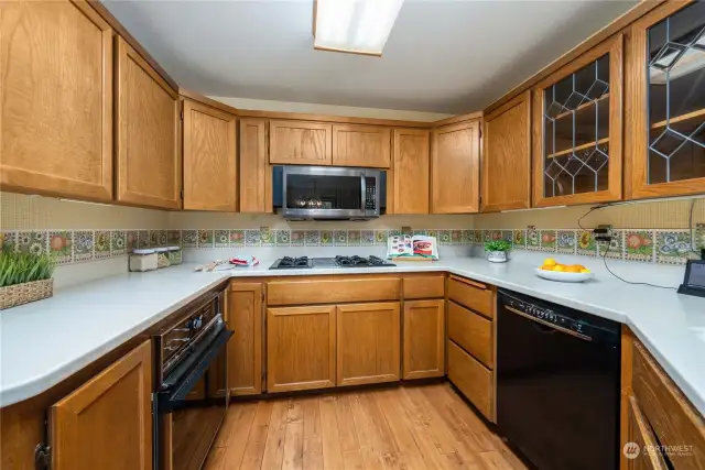 Solid oak cabinets are in great shape and the updated corian counters offer plenty of space for food prep.