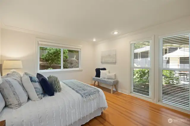 Bedroom #1 looks out to the Courtyard patio and enclosed back yard and garden area.