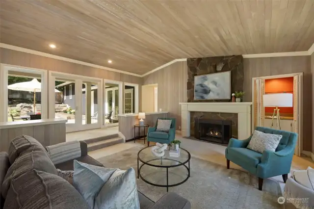 Fun wet bar next to massive fireplace, and Living Room opens to Courtyard Patio.  Vaulted Clear cedar ceilings bring volume to this space!