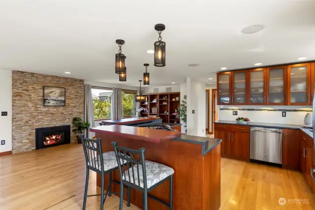 Kitchen with island and fireplace in the dining area