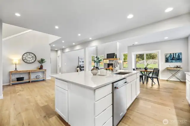 Kitchen looking to nook and 2-story family room