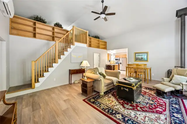 2nd Home - Large living room with high ceilings and a view of the loft.