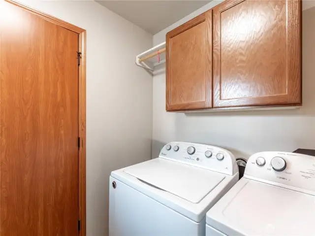 Laundry with storage cabinets