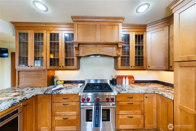 Wolf stove with gas stove top and electric oven.