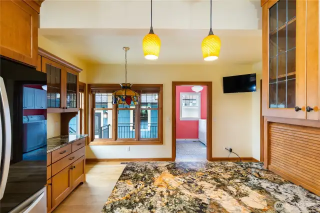 From the kitchen looking towards the dinette are and laundry room with door to garage.