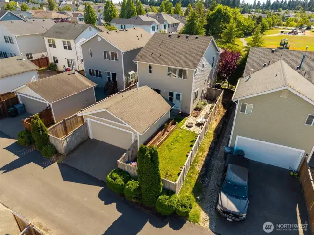 Rear Aerial View of house, detached 2-car garage and house.