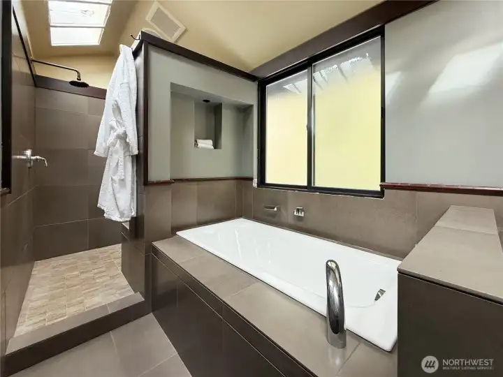Master spa bathroom with dual shower heads, large tub