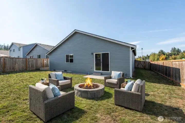 Virtually staged - Fire pit does not convey