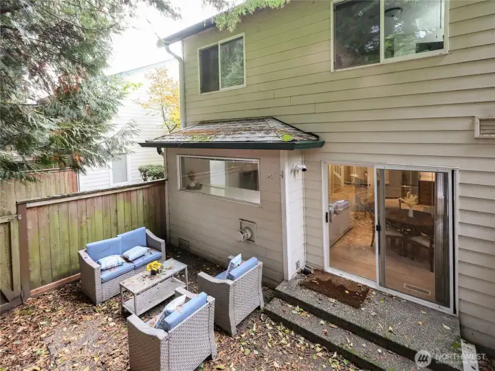Sliding doors lead to a private, fully FENCED YARD with patio perfect for entertaining, or BBQs.