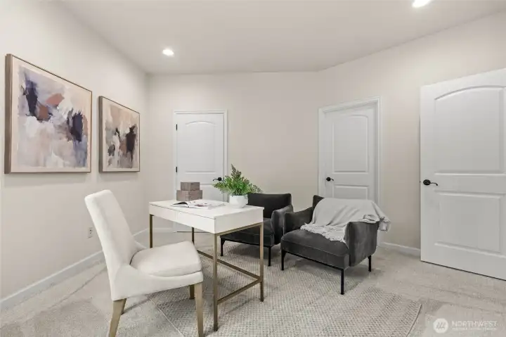 Offering some extra storage, this home office is paired with it's very own closet space.