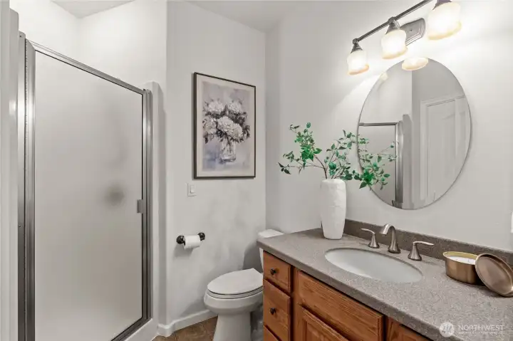Where functionality meets style, this main floor bathroom upgrades itself with it's own glass-enclosed shower.