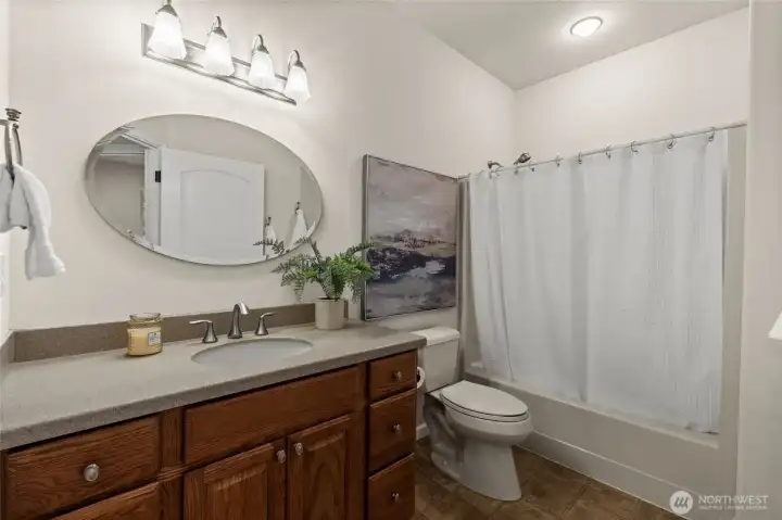 This beautiful shared bathroom is great for guests and/or household residents.