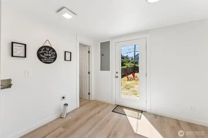 Light filled utility room with direct access to the oversized, fully fenced back yard. Great for indoor-outdoor functionality.