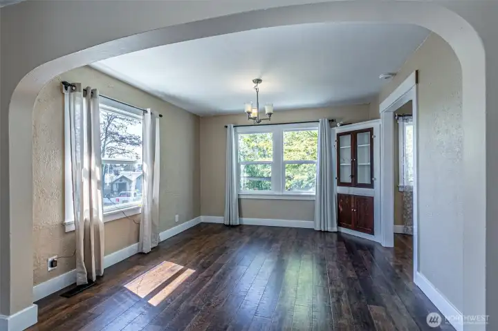 Wall of windows in this space creates abundance of natural light. Quaint dining space.