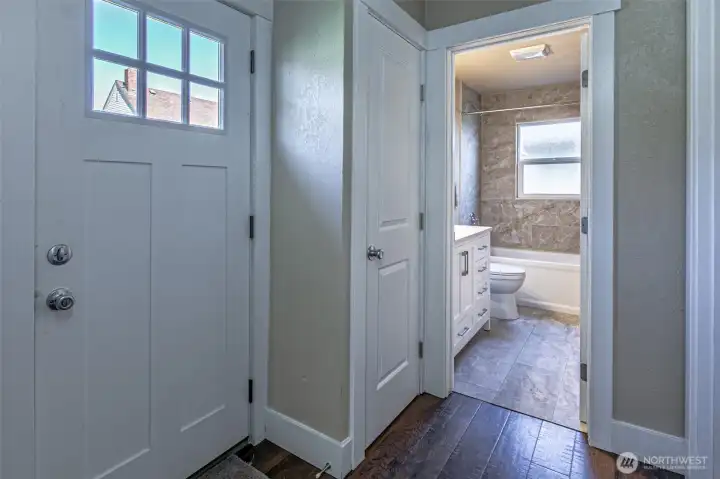 Main level bath and door to outside.