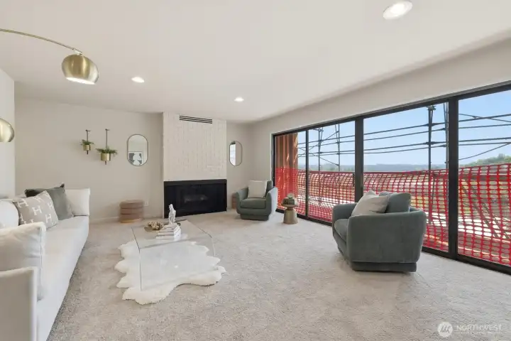 Expansive windows frame sweeping views toward Downtown MI & the Cascade Mountains.