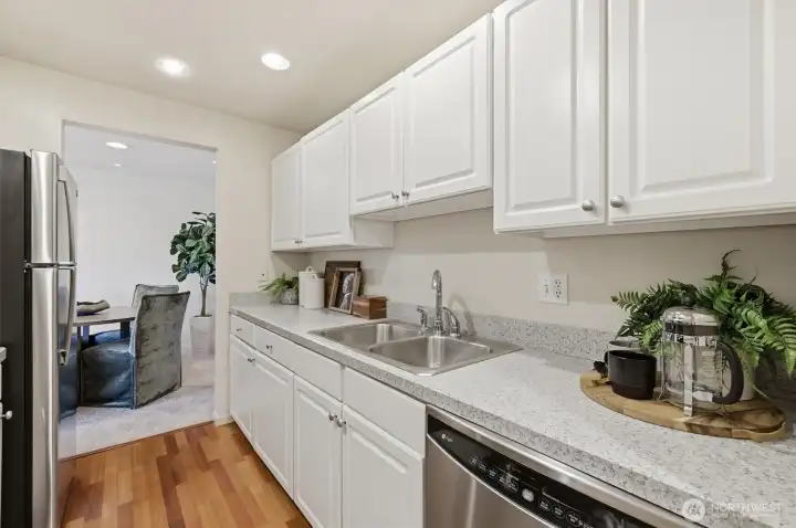 Fresh, white cabinetry provides ample storage space.