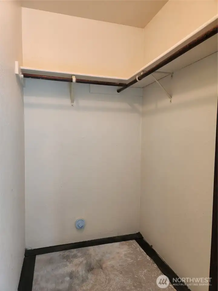 Primary bedroom walk-in closet