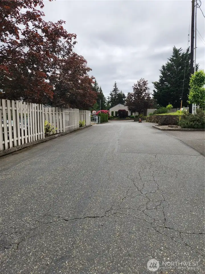 Private drive leading into complex