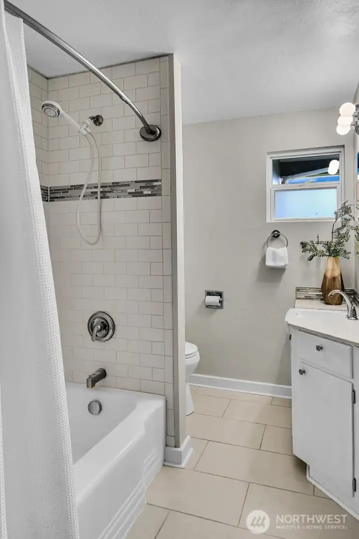 A full hall bathroom completes the main floor. A full hall bathroom completes the main floor.