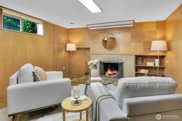Another wood-burning fireplace warms up this finished basement room. Another wood-burning fireplace warms up this finished basement room.
