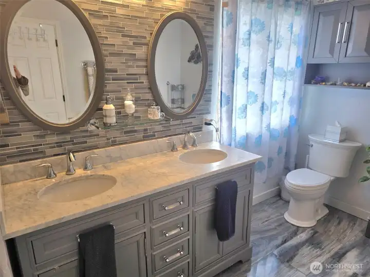 Delux primary bath with walk in closet and marble floors