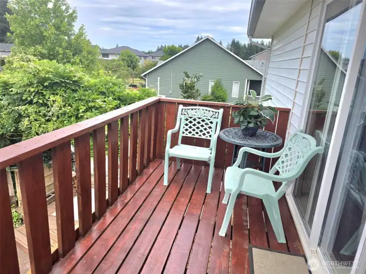 Balcony and deck off the primary suite, second floor