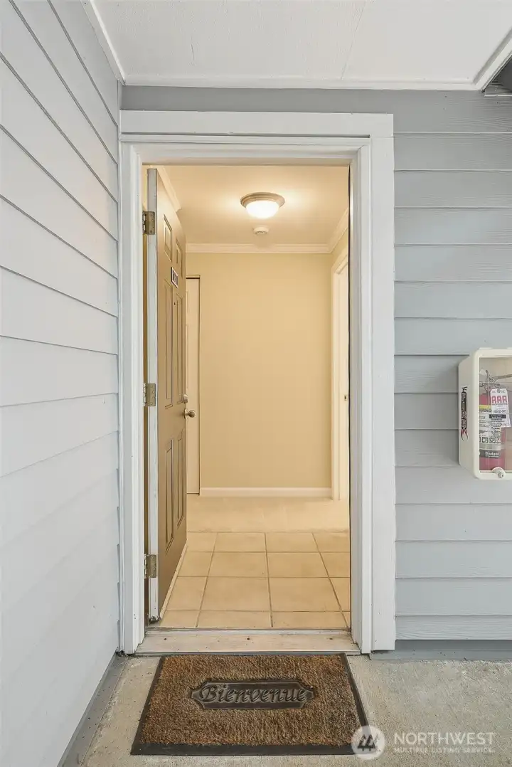 Front door to ground floor, end unit private condo with one bedroom, one bathroom, 739 square feet.