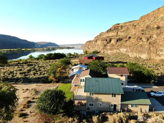 Beautiful airel view of property with the river to the right and also in front