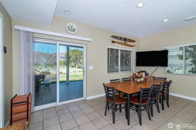 Dining area leading out to the covered deck where you will spend most of your time if not at the sandy beach.