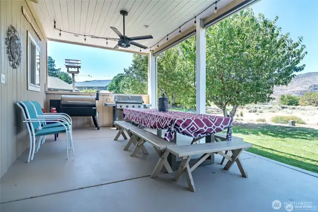 Outdoor sitting area, covered with a fan. You will never want to leave!