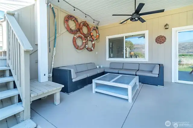 Outdoor sitting area, covered with a fan. You will never want to leave!
