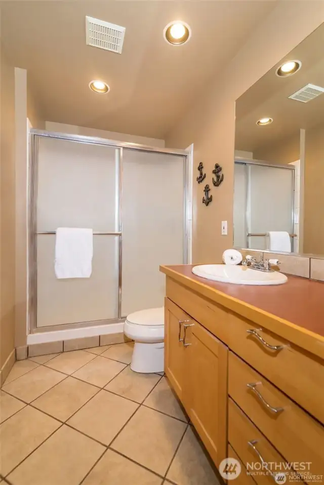 Upper bath with a full-size shower