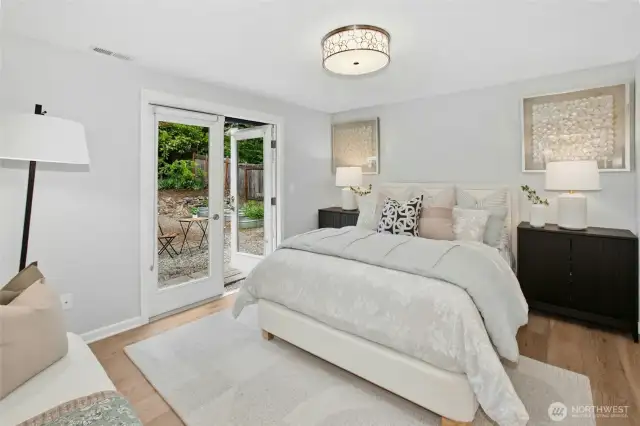 Beautiful primary suite that opens up to the backyard.