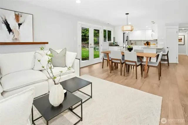 Space for a large dining table with gorgeous light fixtures throughout the home.