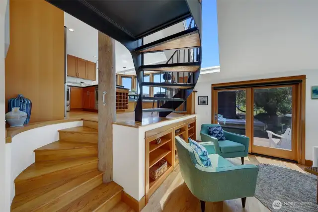 Just take a look at that beautifully crafted staircase with the oak hardwood floors transitioning into the dark iron to create definition and depth.