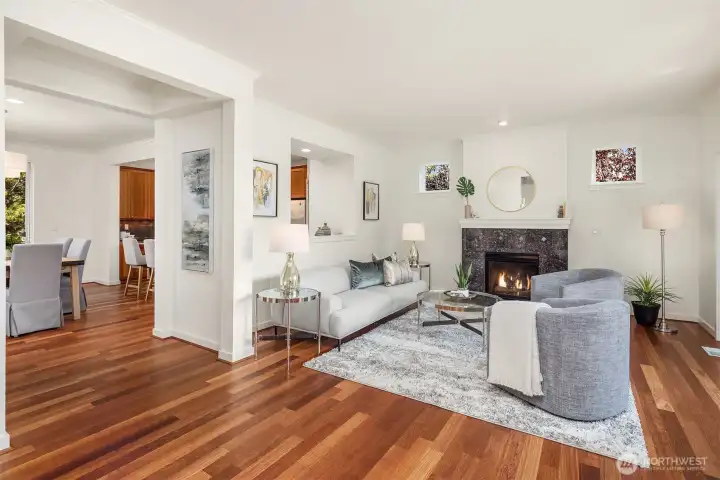 An angle highlighting the orientation of the living room to the kitchen. The pass-through ensures the ones preparing the meals are still a part of things.