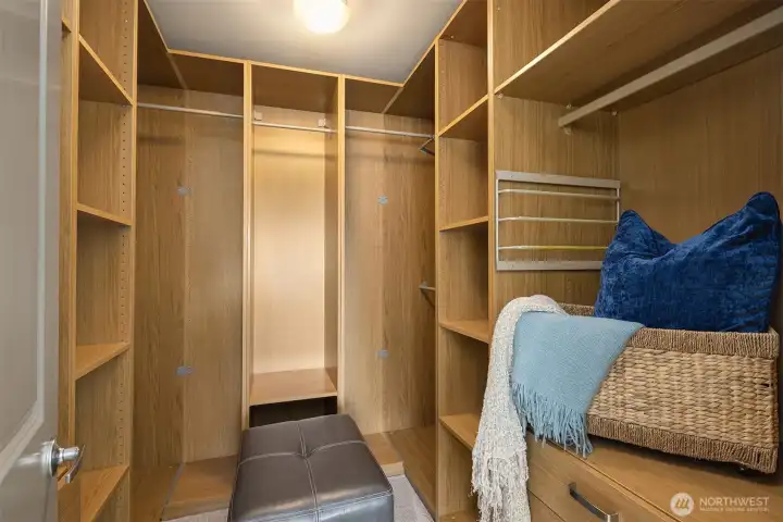 The primary closet is beautifully appointed.