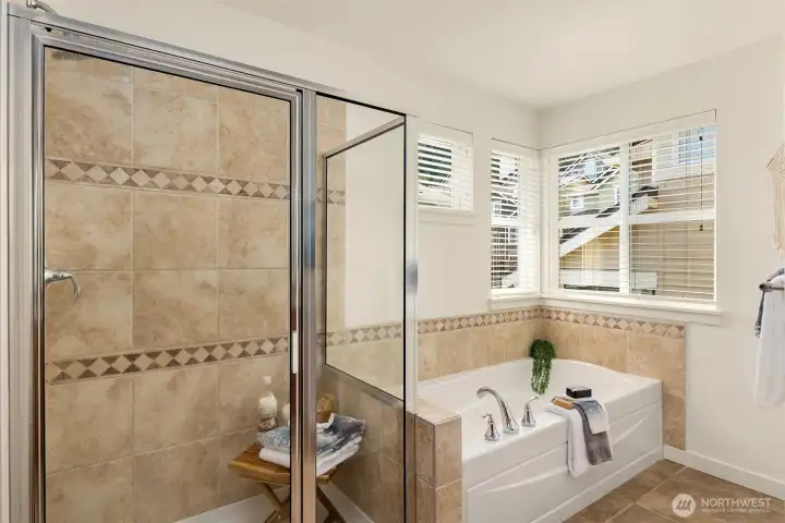 So much natural light in this bathroom! Not shown is the separate water closet.