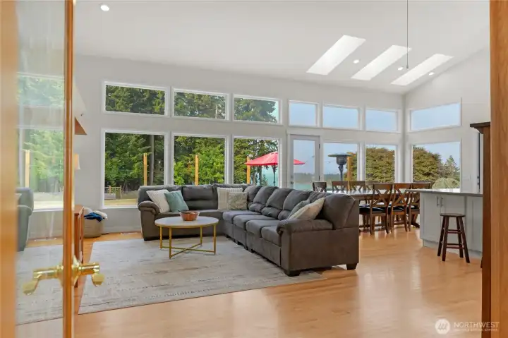 French door entry into living, dining and kitchen space.
