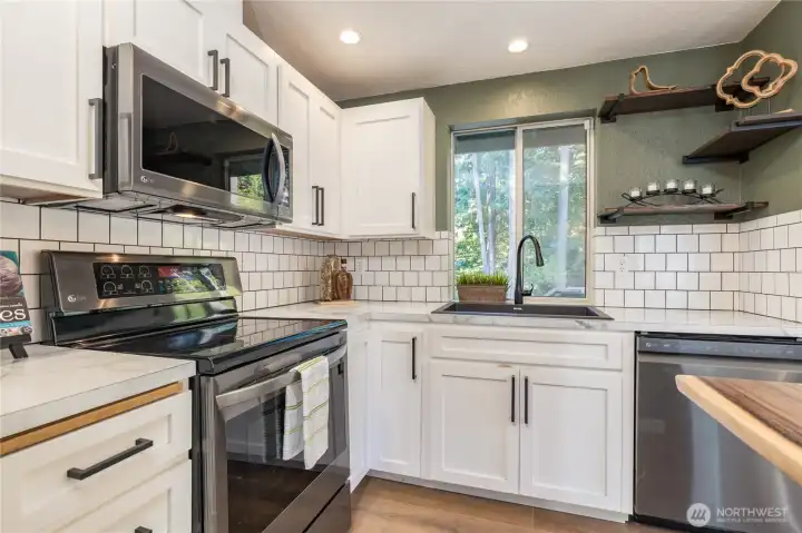 Crisp white cabinetry and classic subway tile backsplash