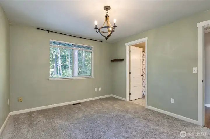 Primary bedroom has direct access to the full hall bath