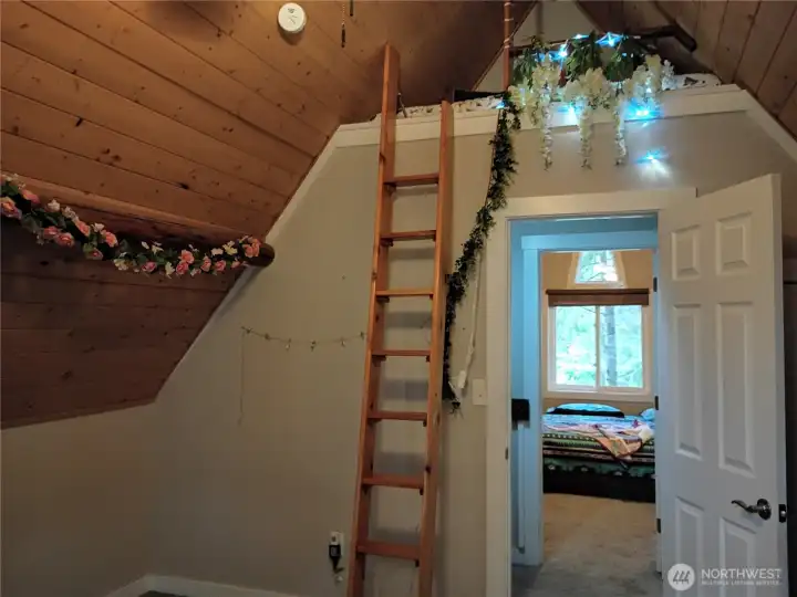 bedroom with loft looking across to other bedroom