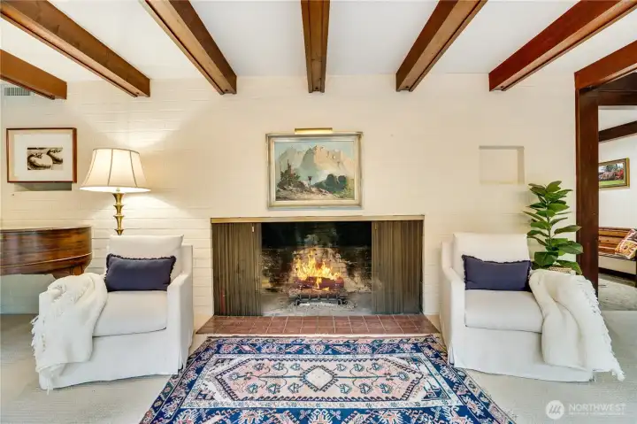 Grand fireplace in the living room with room for a grand piano to the left.