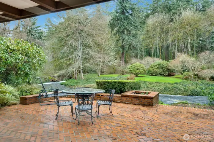 Chambers Creek provides a soothing background. Brick patio off the living & dining rooms features built in planters & seating.