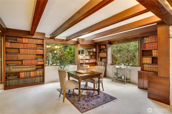 This is the other end of the family room with creek views & more built ins.