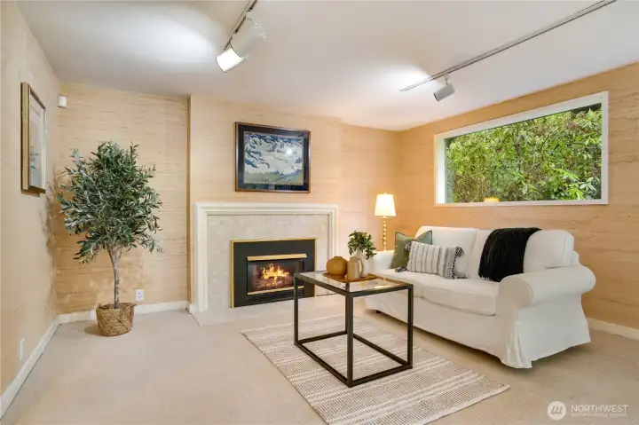 Master suite seating area with wrapped details around fireplace.