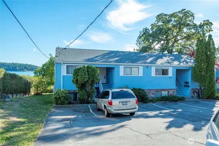 Apartment parking area and side yard on the East.